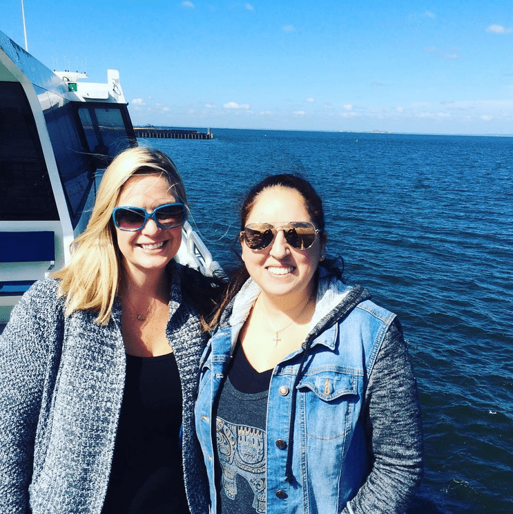 Two women on the ferry looking out at the water