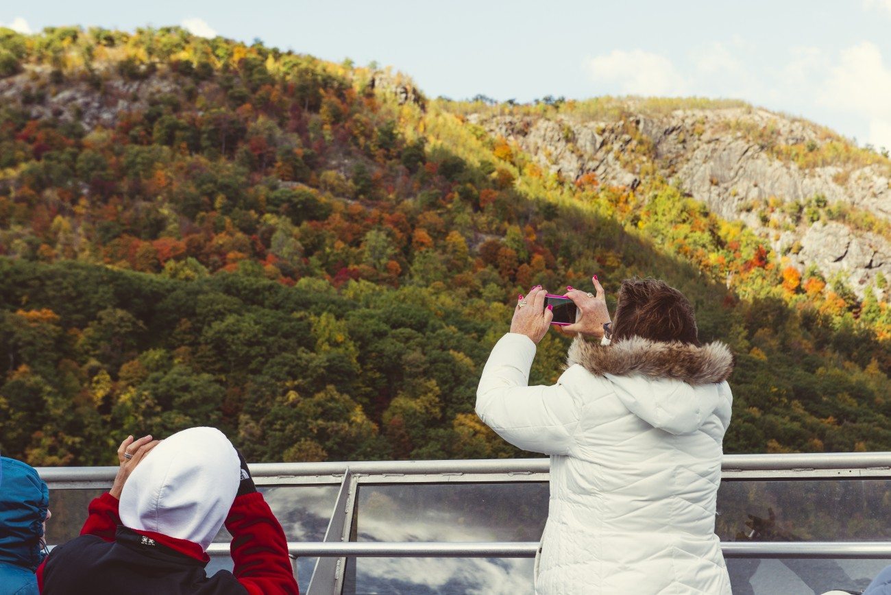 Passengers taking pictures of the fall colors