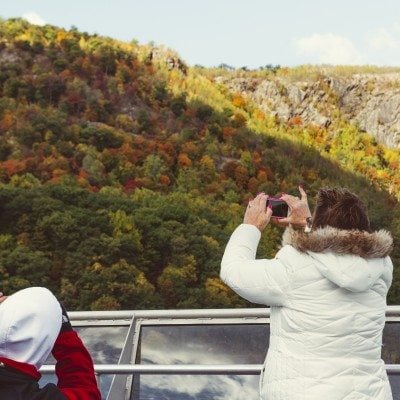 Passengers taking pictures of the fall colors