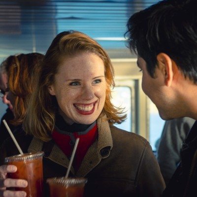 Passengers enjoying beverages inside the ferry