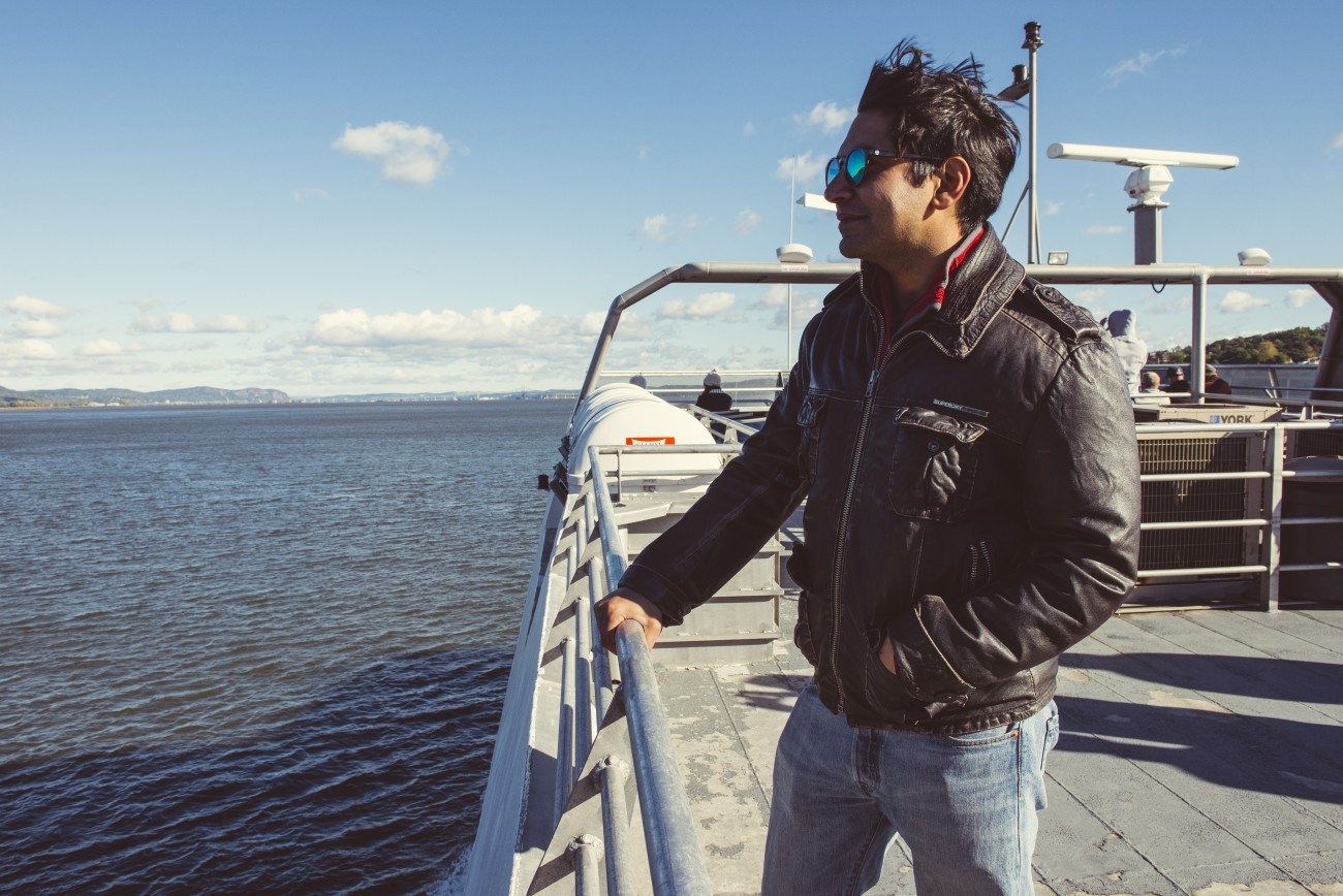 Man looking out over the water from the ferry