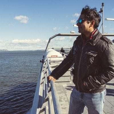 Man looking out over the water from the ferry