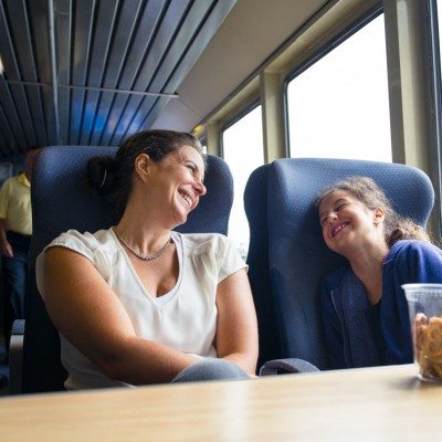 A mother and her daughter enjoy the comfort of a Seastreak ferry