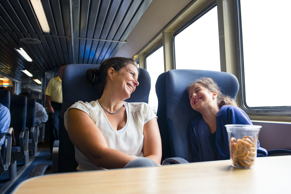 A mother and her daughter enjoy the comfort of a Seastreak ferry