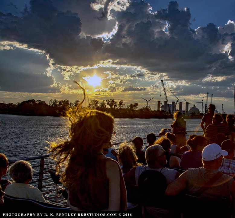 Passengers watching the sunset from the ferry
