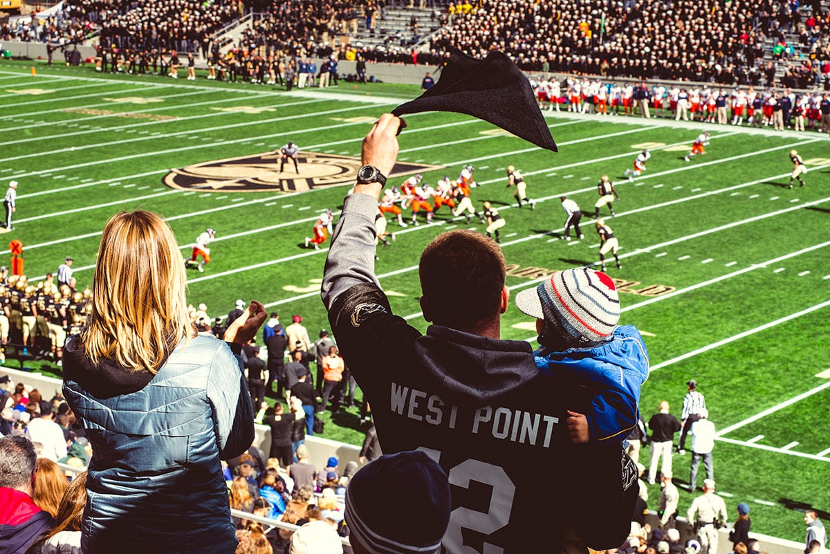 Fans cheering on Army